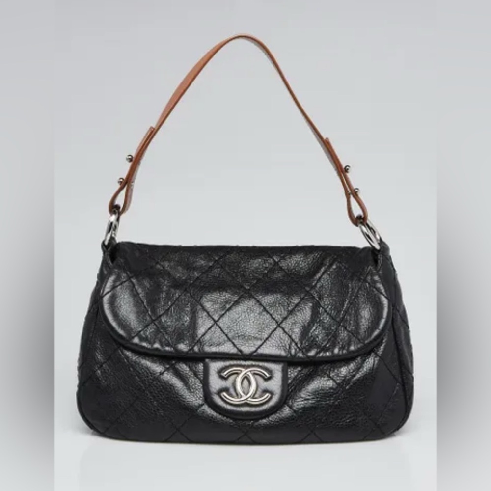 CHANEL
Black Quilted Glazed Leather On The Road Flap Bag